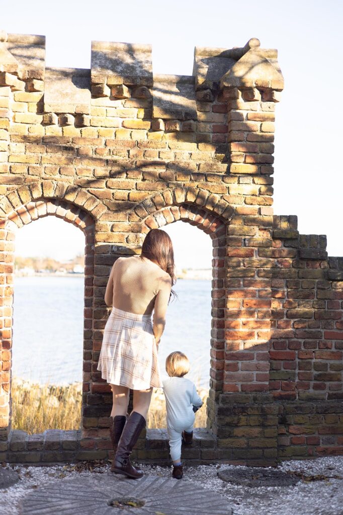 A Mom and Son look out from a Castle Folly at the Hermitage Museum by Mary Eleanor Photography.