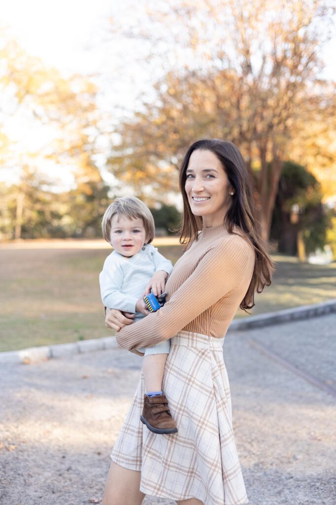 A Mother and son smile at the camera during at their Family Photo Session.